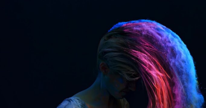 Slow Motion Close Up of Woman covered in colorful powder, vibrant motion of pigments around her head, symbol of creativity, energy and artistic freedom at 1000 fps