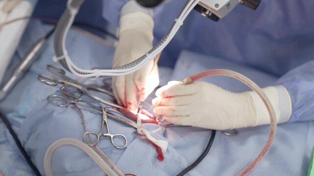 A surgeon performs tympanoplasty surgery on a patient to help him hear