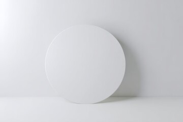 Minimalist white circle on a white background with soft lighting and shadow clean