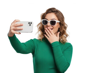 Young woman taking a selfie a smartphone, isolated on transparent background