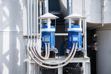 Pumps and piping in water treatment facilities,Pump station for reverse osmosis industrial city water treatment station. Wide angle perspective. 