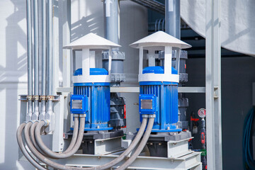Pumps and piping in water treatment facilities,Pump station for reverse osmosis industrial city water treatment station. Wide angle perspective. 