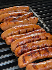 Golden Brown Sausages Grilling Outdoors