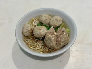 Close up of bakso urat, Indonesian beef tendon meatballs in savory soup. BSD, Indonesia - October 19, 2025