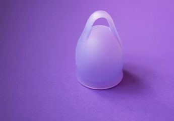 Product shot of menstrual cup. Minimal aesthetic and eco-conscious design.