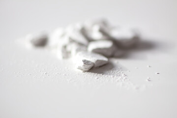 Closeup of loose powder with fine particles. Softness and tactile appeal in focus.