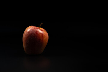 Red apples on a black background. Red apples.