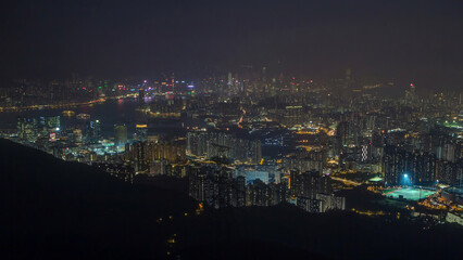 Day to night timelapse from Fei ngo shan Kowloon Peak night Hong Kong cityscape skyline.