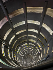 Obraz premium Spiral parking garage ramp with safety net.