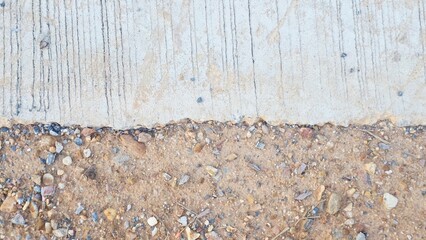 Textured Surface Close-up of Pebbles and Concrete with Unique Patterns and Colors