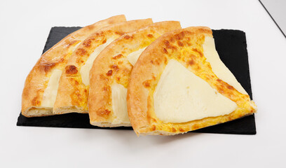 Fresh Georgian Khachapuri Slices On Slate Plate For Casual Snack Or Party