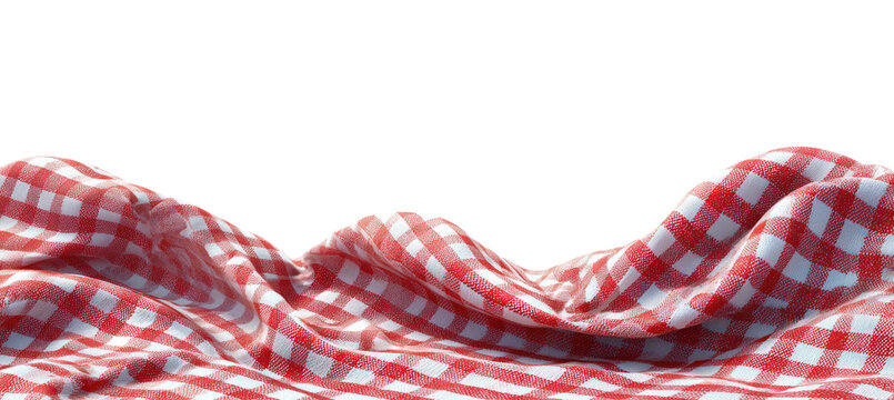 A portion of a red and white checkered tablecloth against a black background, folded, draped