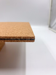 Macro photo of a cork composite panel showing fine details of the rubber line and granulated cork texture.