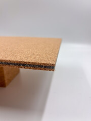 Side macro of cork rubber sheet showing detailed layered pattern and porous texture.