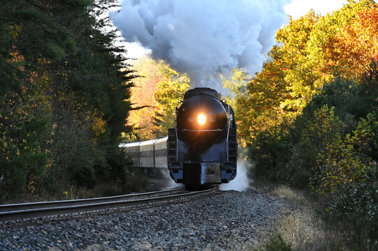 Vintage steam engine railroad train on fall foliage excursion in Virginia autumn