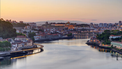 Fototapeta premium Aerial view before sunrise at the most emblematic area of Douro river timelapse.