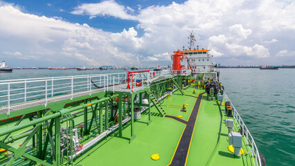Green deck of the tanker under blue sky timelapse