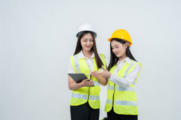 A studio presentation features 2 Asian female engineers working with architects, highlighting their leadership in the industry and demonstrating global business potential through innovation.