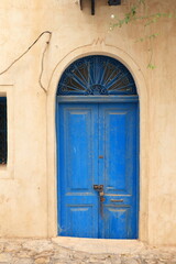 Blue Arched Door with Window Grill in Houmt Souk, Djerba, Tunisia