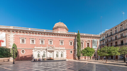 Patriarch's College Square in Valencia timelapse, featuring fountain with sculptures. Spain