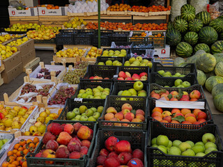 Fruit stand with assorted fresh produce at local market