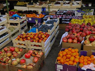 Fruit stand with assorted fresh produce at local market