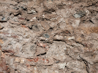 Old weathered stone and mortar wall texture background