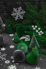 Creative New Year concept. Christmas composition, festive decoration, handmade balls and firs