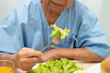 Asian elderly woman patient bored with food, anorexia loss of appetite.
