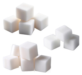 Three piles of refined sugar cubes falling on transparent background