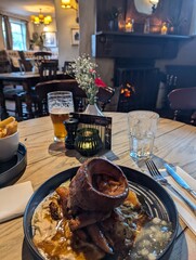 sunday lunch in English pub around cosy fire 