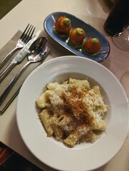 creamy pasta with arancini at Italian restaurant 