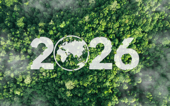 Aerial view of green forest with 2026 and Earth icon for environmental awareness, sustainability goals, and climate change action, happy new year and environment day, carbon reduction to net zero.