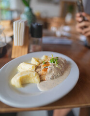 Grilled chicken fillet with mashed potatoes and creamy sauce