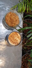 Cup of coffee served with fruit crumble dessert in a modern cafe setting, mobile photo. Cozy and contemporary atmosphere ideal for illustrating leisure, lifestyle, and relaxation themes.