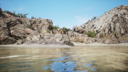 Obraz premium Clear waters reflect the sky as rocky cliffs rise around a tranquil beach. The scenery showcases a peaceful, natural retreat perfect for relaxation and exploration at any time of the day.