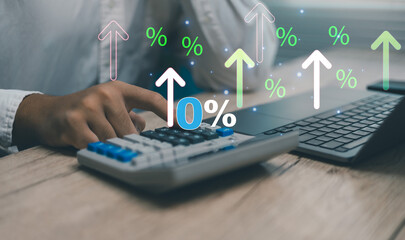 Businessman using calculator with rising percentage symbols and arrows representing financial growth, investment, data analysis. Modern finance technology and digital economy business concept