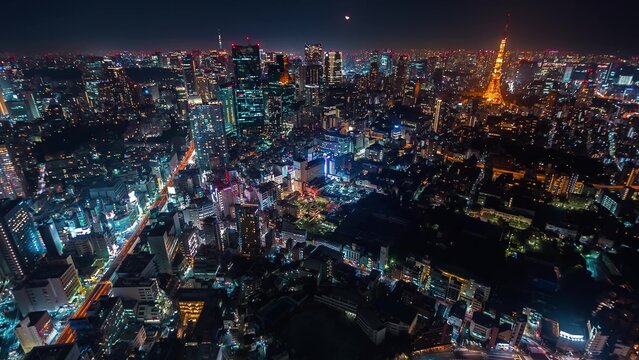 Fototapeta City skyline illuminated at night with glowing and vibrant urban lights showcasing modern architecture and nightlife energy