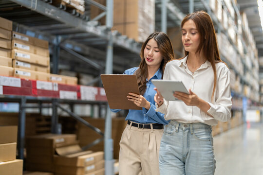 Female engineers team discussing inventory in warehouse logistics and supply chain planning, operation management, data analysis, warehouse shipping, inventory tracking, optimization and technology