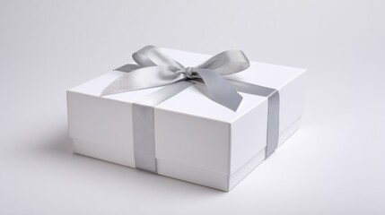 Obraz premium Elegant White Gift Box with Silver Ribbon on Clean Background, Perfect for Celebrations and Special Occasions