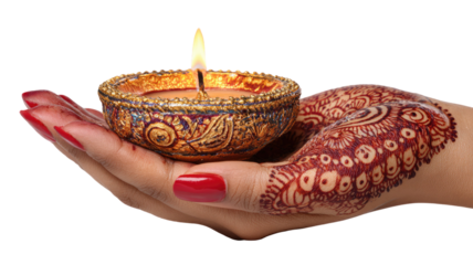 Beautiful hand holding a Diwali diya with intricate mehndi design and glowing flame isolated on white background

