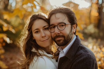 Portrait of a merry couple in their 30s looking at the camera