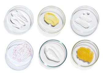 Petri dishes with cosmetic products on white background, top view