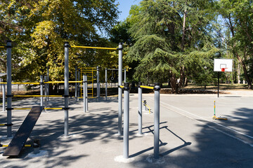 Fototapeta premium Sportground in the city park in warm autumn sunny day