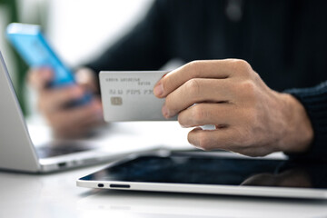 Man using credit card and paying via mobile banking app. Internet payment, online shopping, concept.