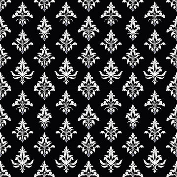 A seamless damask pattern with white victorian floral ornaments on a black background. This gothic style is perfect for elegant website backgrounds, textile prints, or dark romanticism concepts