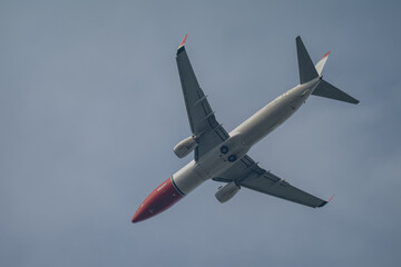 Jet Airliner Soaring Overhead Against a Blue Sky with Copy Space