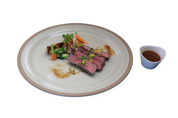 Exquisite steak dish with side vegetables. This culinary creation is a feast for the eyes and a promise of delightful flavors