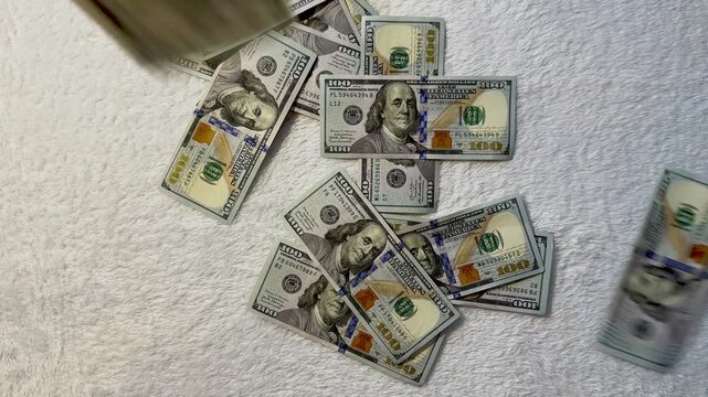 Paper money falling from above in slow motion. Symbol of wealth, success, or financial freedom. Dramatic and cinematic cash rain
