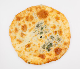 Georgian Khachapuri Pkhlovana With Herbs and Melted Cheese On White Surface